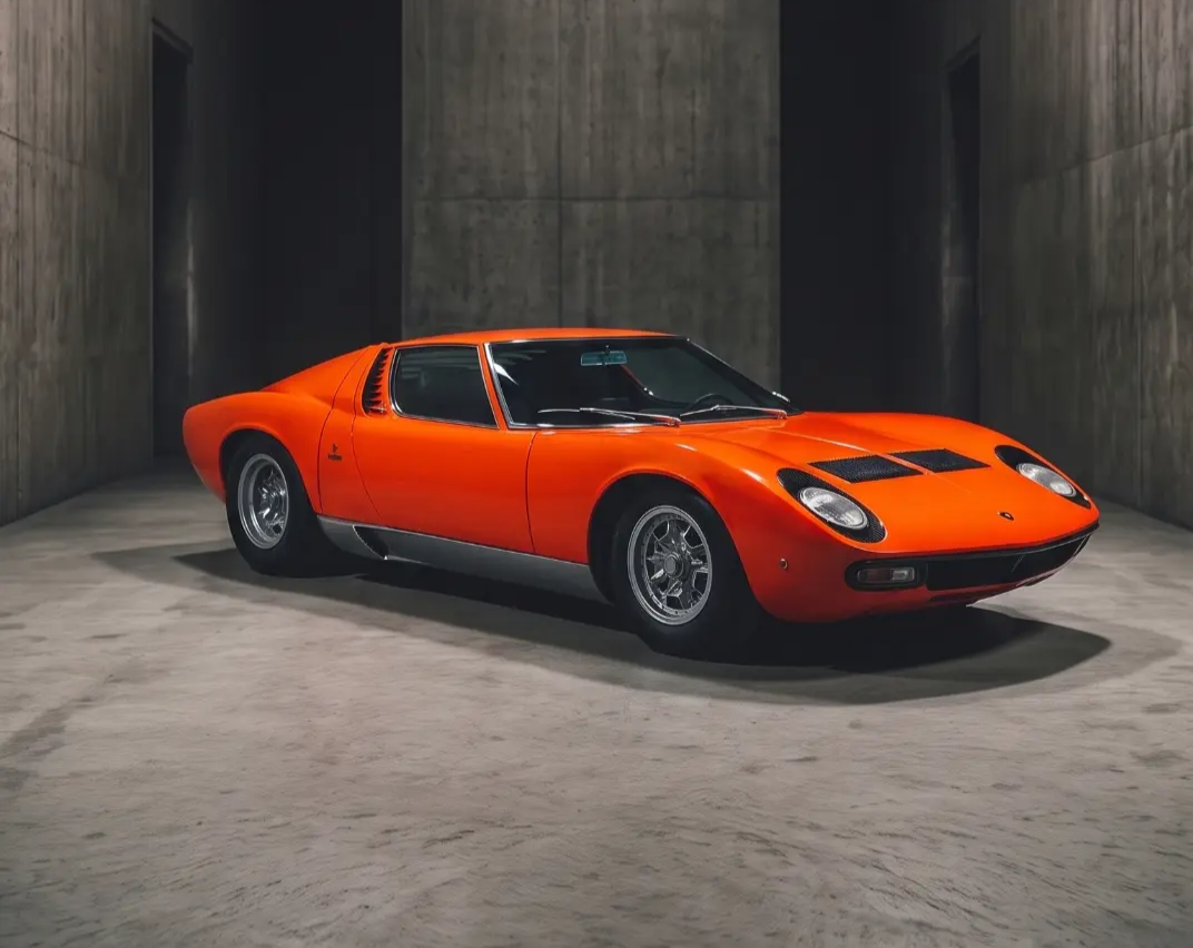 Orange Lamborghini Miura in a concrete vault